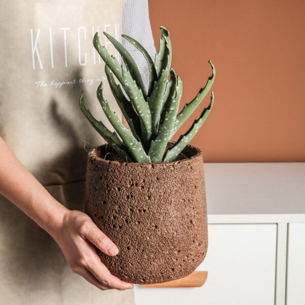 Brown Nordic Style Cement Flower Pot held indoors with plant