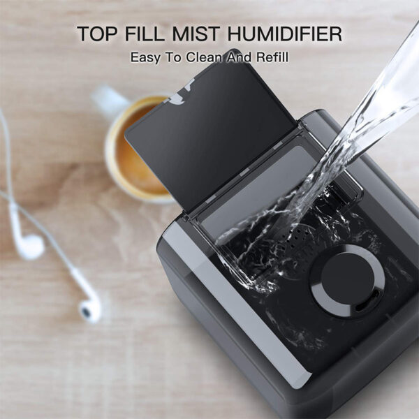 Demonstrating the top fill system of the ultrasonic humidifier for easy refilling and cleaning.
