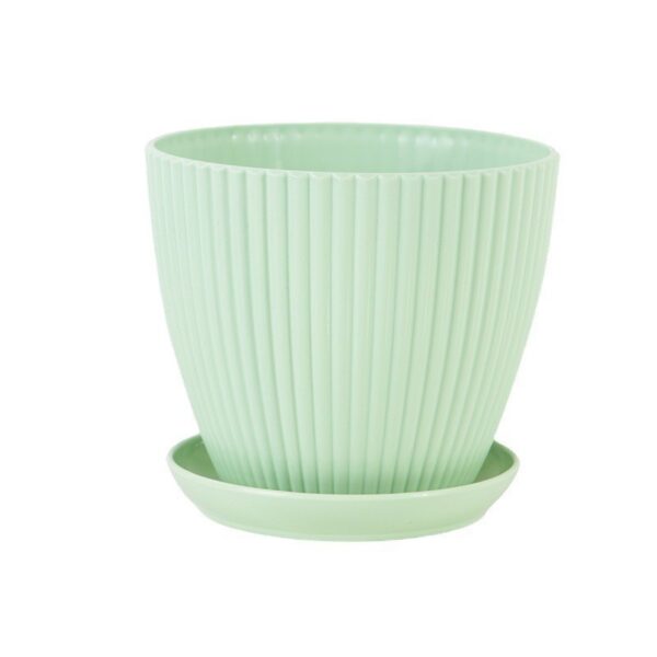 Mint green plastic flower pot close-up
