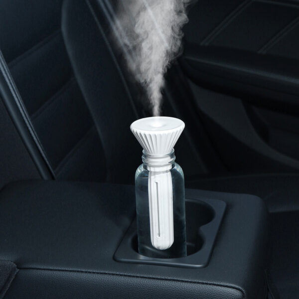 Portable humidifier for plants in a car, providing moisture to the air for plants during travel.