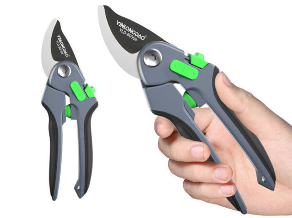 Silver pruning shears held in hand, showing precision cutting.