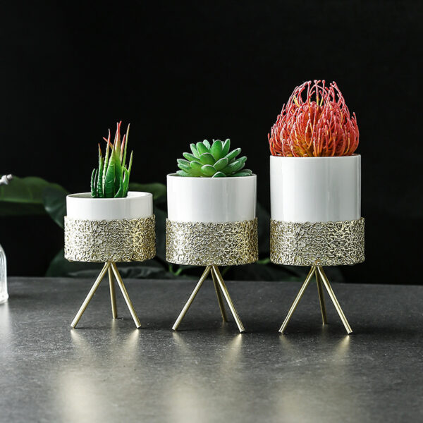 White modern ceramic pots styled in a home decor setup