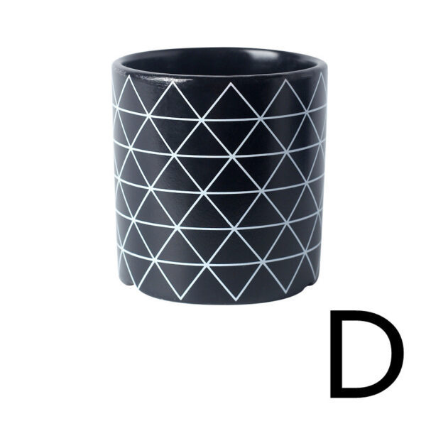 Handmade ceramic planter with triangle motifs