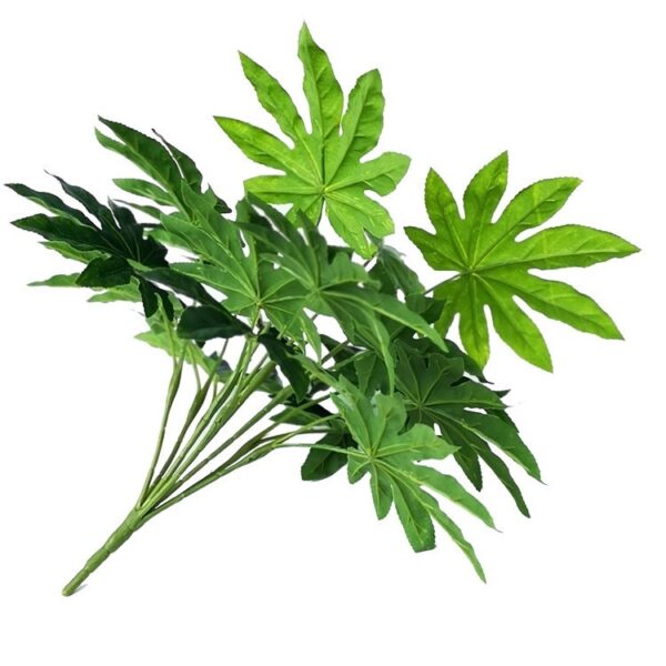 Close-up of artificial Fatsia Japonica branch showing detailed leaves and stem.
