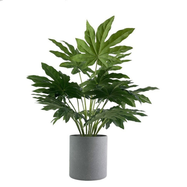 Fatsia Japonica artificial plant in a gray pot with broad green leaves.