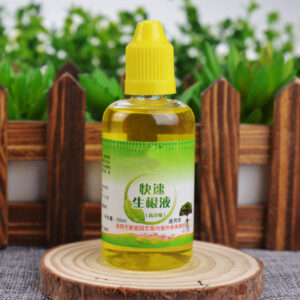 Plant nutrient bottle on wooden table with decorative bark background indoors.